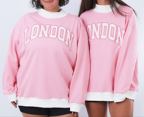 Two pink sweatshirts with 'LONDON' text on a white background
